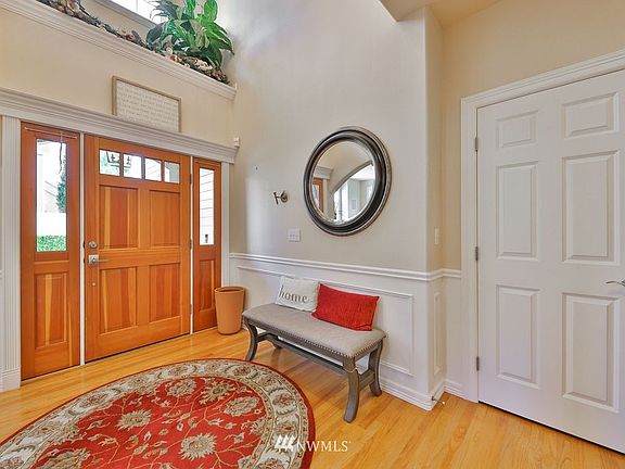 Lovely two story entry with side light door and lots of molding.