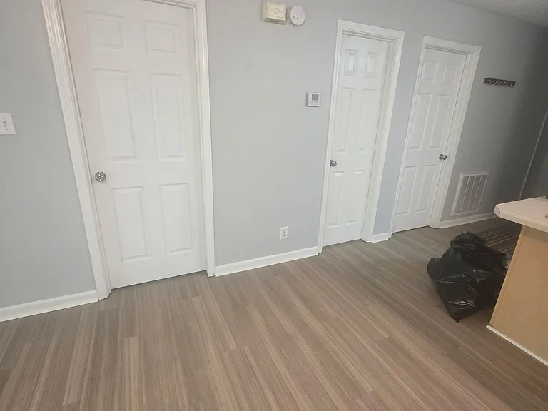 Pretty wall color
Left door is back bedroom
Middle door is center bath
Right door is front bedroom (that also has a door leading to center bathroom