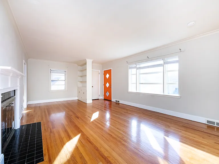 LIVING ROOM, BUILT-IN BOOKSHELF, FRONT DOOR, LOTS OF NATURAL LIGHT, FIREPLACE (DOESN'T WORK)