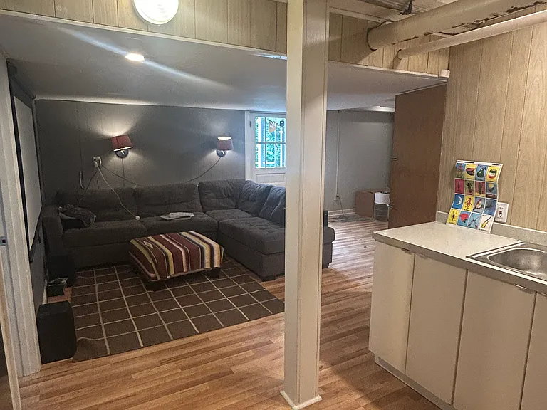 lower level level - basic kitchen: sink, fridge, range, no dishwasher, very little kitchen storage.