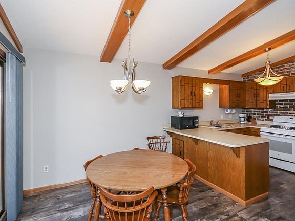 The dining room also has brand new laminate flooring. With a patio door off to the large deck  overlooking the park. Enjoy the morning sunrise on your deck!