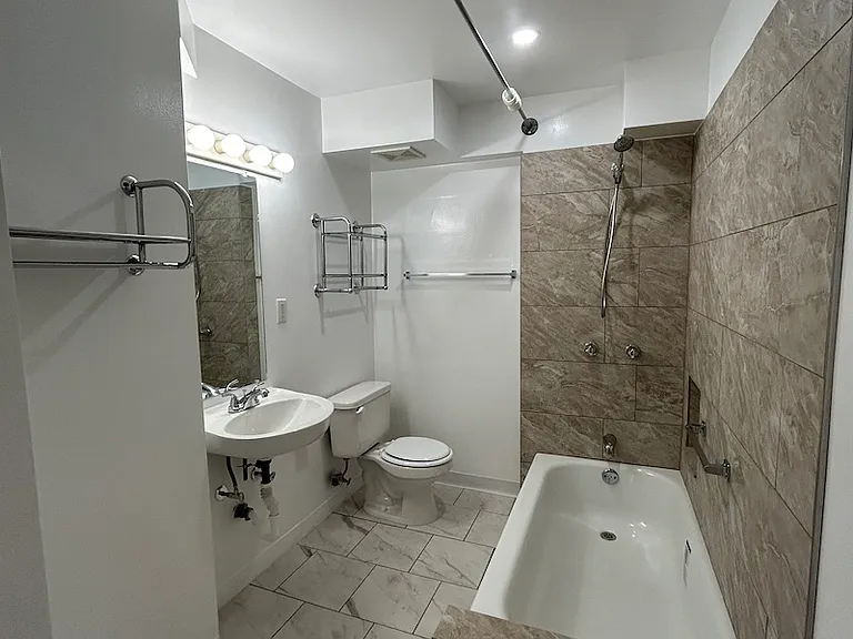 fully remodeled bathroom
new tub, tile, sink, and faucet