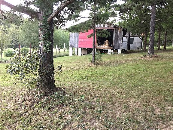 Big shed next to garden.