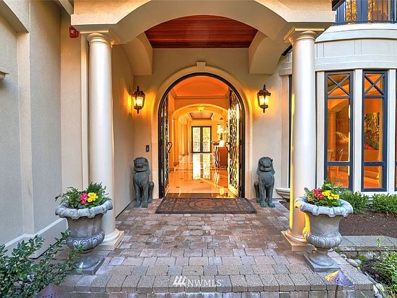 Custom metal doors handmade in Bali Indonesia, with glass door insets that open.