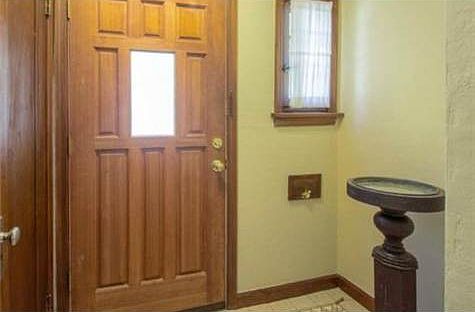 Tile in entry with coat closet and sweet window.