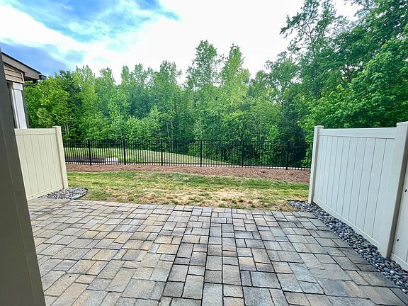 Backyard with paver patio and fence