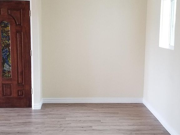 View of the entry door and the dining room