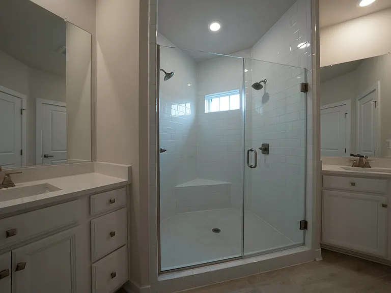 Owner's Bathroom features his and her vanities and Roman shower with dual shower heads