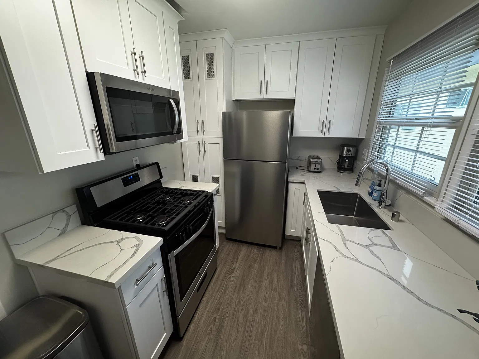 Representative renovated studio in the building; finishes and appliances vary by unit.