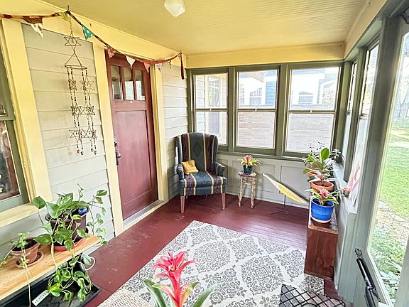 Cozy screened-in front porch.