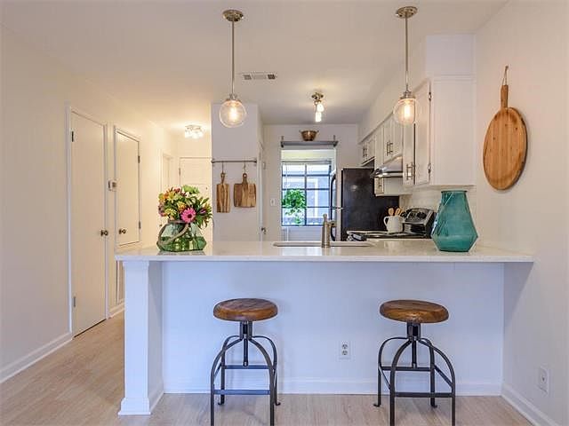 Light and bright kitchen that opens to the living room.