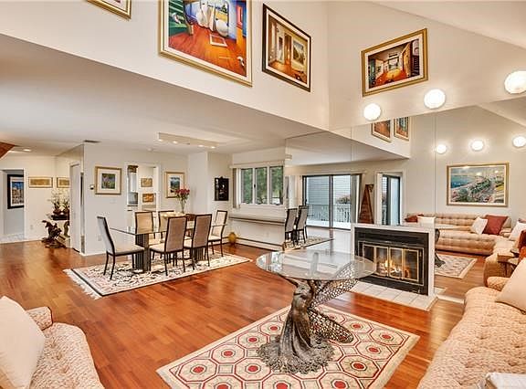 Perfect for entertaining - open floor plan - living room with wood burning fireplace