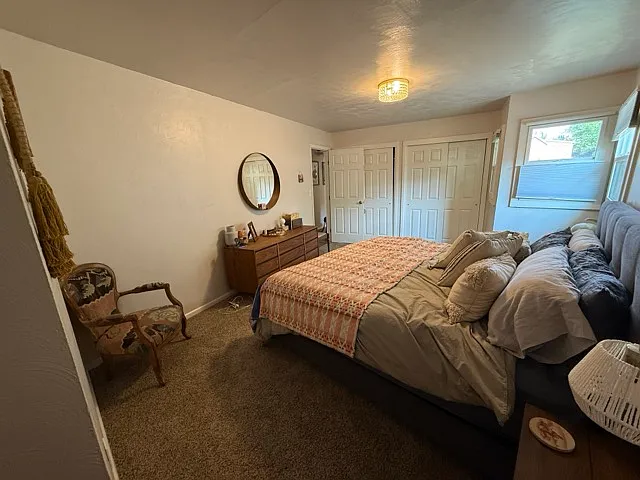Double closet in primary bedroom.