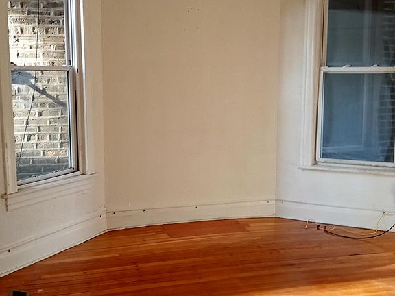 Living room area (partial view) with 2 large windows