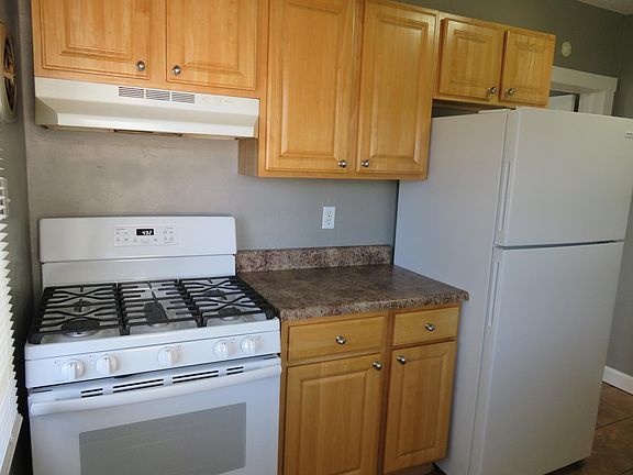 Kitchen w/ample cabinetry and brand new 5-burner stove/oven and brand new fridge.
