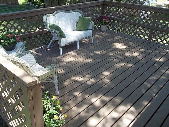 Relaxing patio in beautiful fenced in back yard outside slider door on back side of home