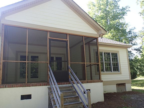 Screened in porch overlooks backyard and natural area. Very Private.