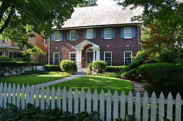 Classic Colonial with Slate Roof and Picket Fence