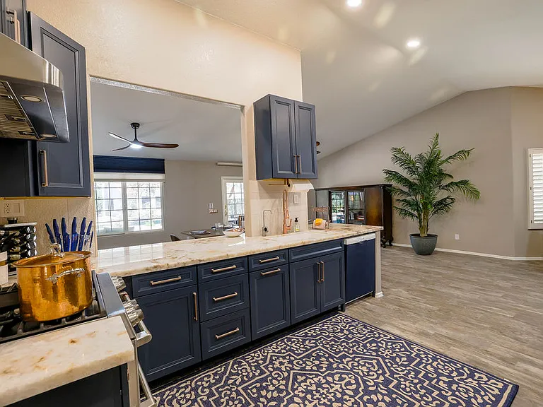 Kitchen with dbl oven GE CAFE gas stove, dbl sink, RO water filter with remineral cartridge, dishwasher, spices, utensils, granite stone cookware