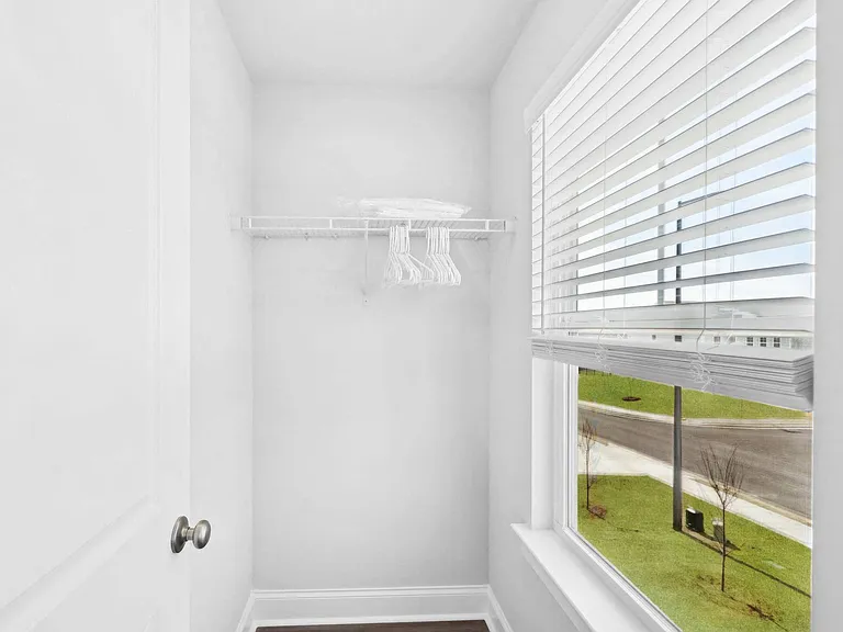 Walk in closet in secondary bedroom