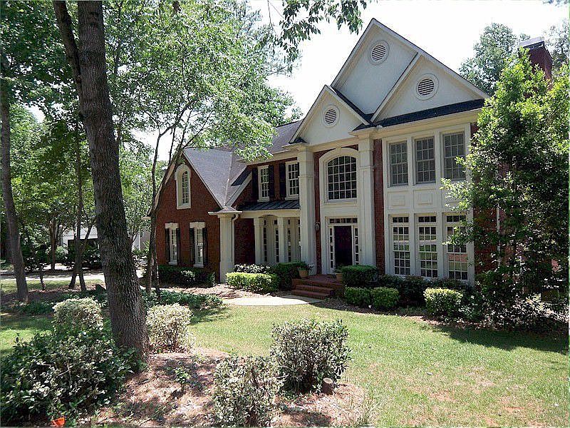 Three sides brick. Side entry three car garage.