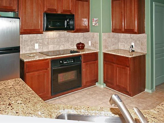 Kitchen with Granite counters and Stainless Appliances