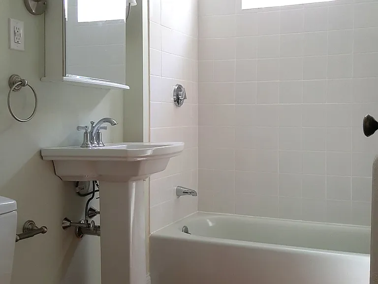 Modern updated bathroom with Tiled Shower.