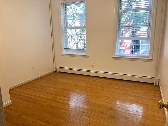 Living room features a storage closet in the near left corner