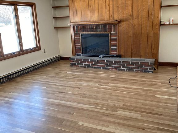Living room with electric insert in fireplace