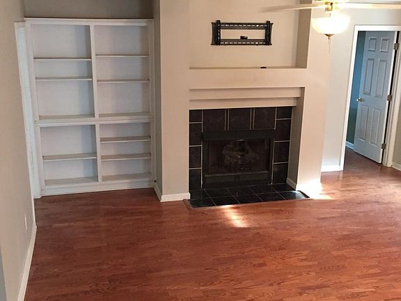Great room with fireplace and built in bookshelves