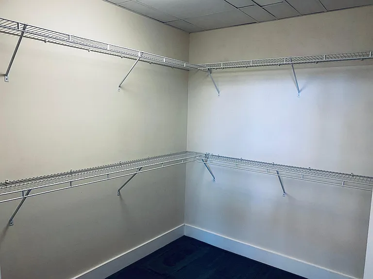 Large walk-in closet in master bedroom.