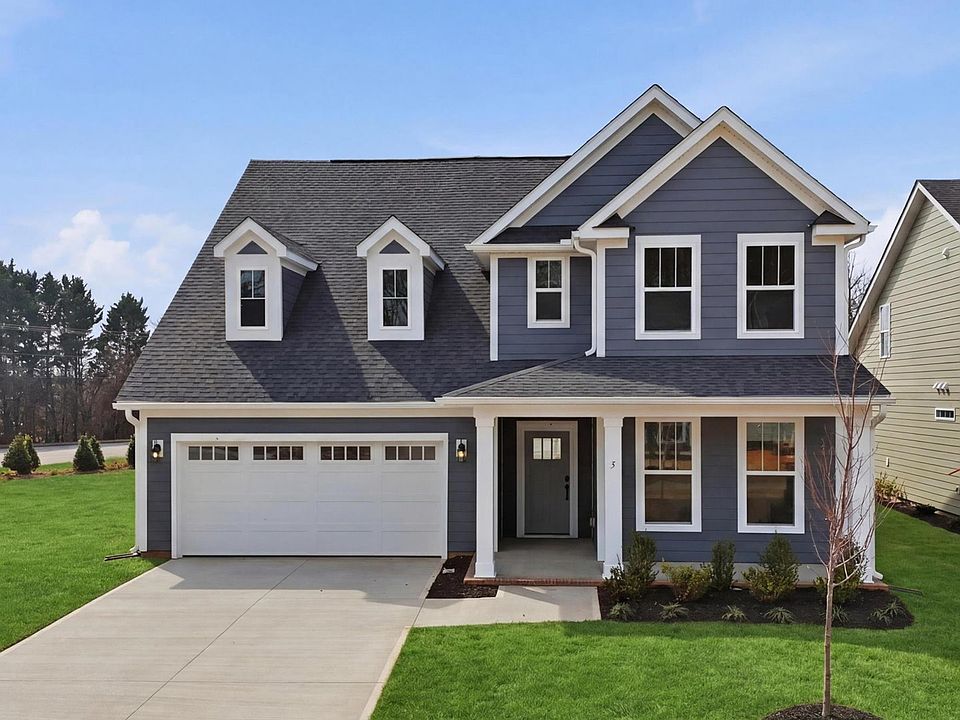 Elegant exterior with eye-catching curb appeal in a first-class DRB Homes Pelham Crossing community