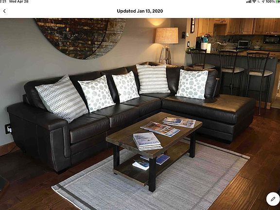 Relax on the leather couch in the living room..open to both the kitchen and dining room.