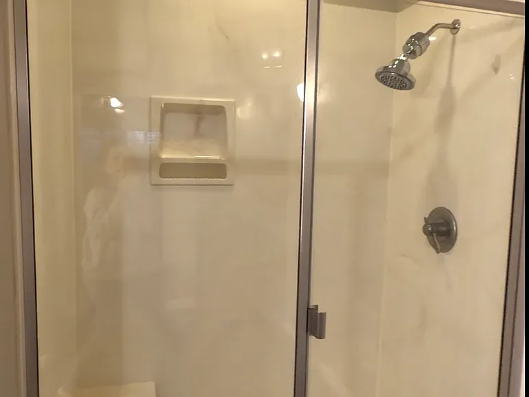 Master bathroom shower with built-in seat
