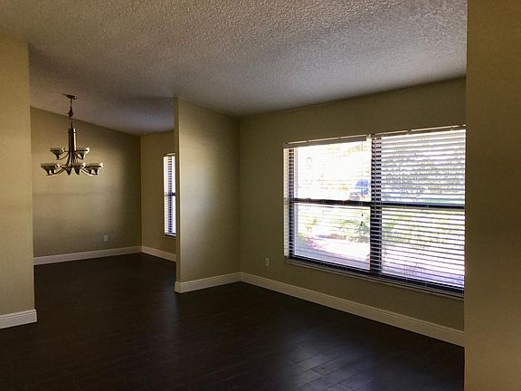 Living room & dining room w new floors & ceiling