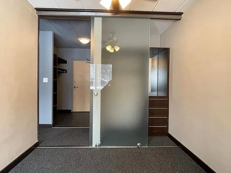 Step into modern living with sleek, glass-paneled features and ample space at LS Capital Group. This well-designed interior offers the perfect blend of comfort and style. Explore your new home today!