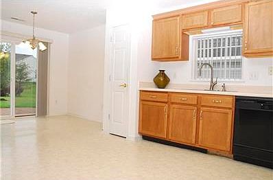 Kitchen overlooks large backyard