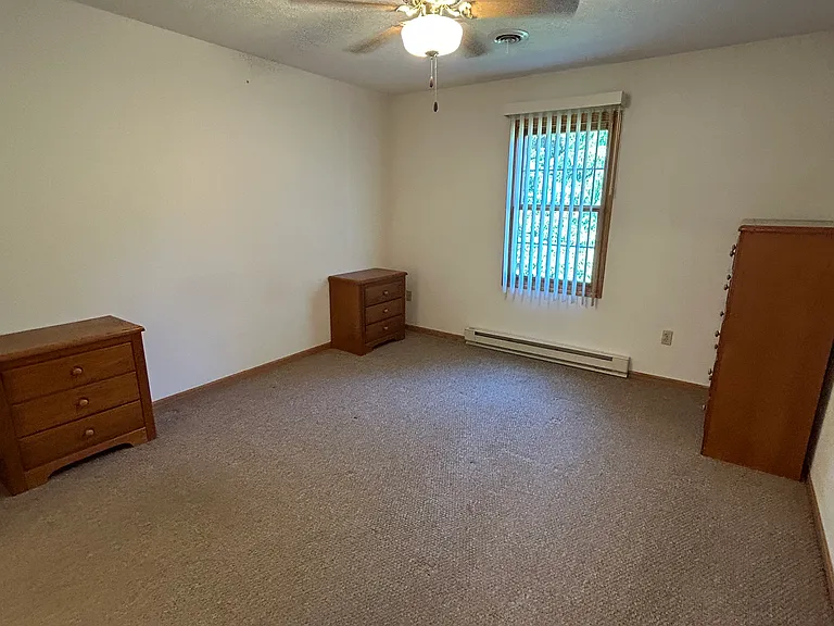 main bedroom, ceiling fan and window coverings