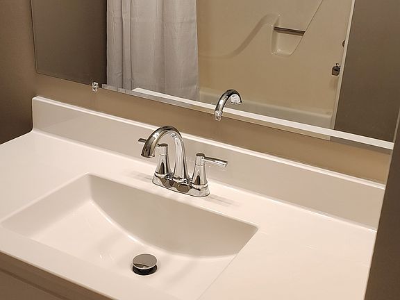 Vanity Top and view of tub from mirror