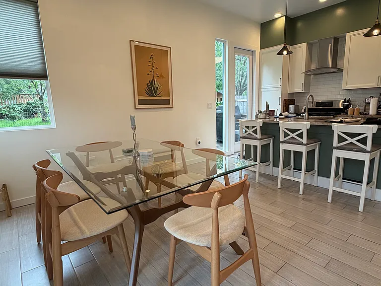 Kitchen with eat-at island and large dining room area.