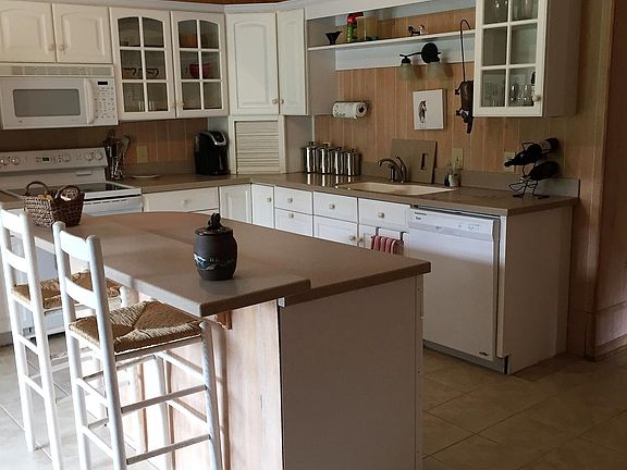 Kitchen w/ island open to deck