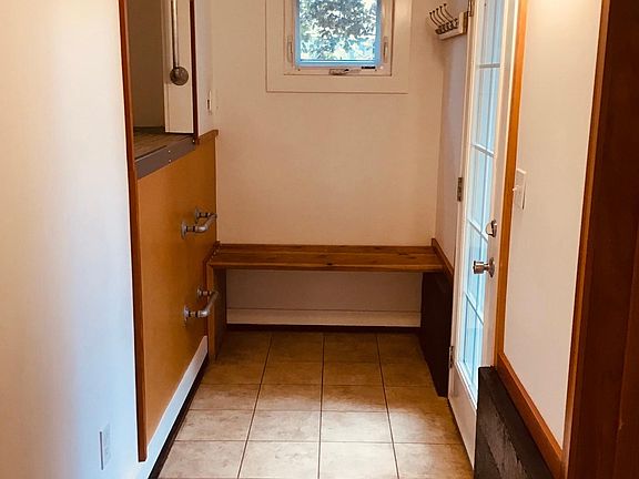 Built in seat and coat rack.