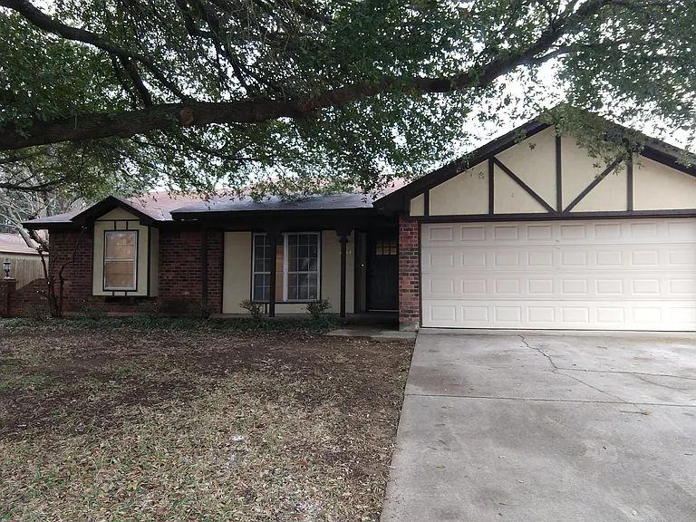FRONT OF THE HOME: New Landscaping is to come soon.
TWO CAR GARAGE with garage door opener