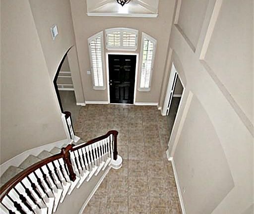 BIRDS EYE VIEW OF THE TWO STORY ENTRY WITH ART NICHE.