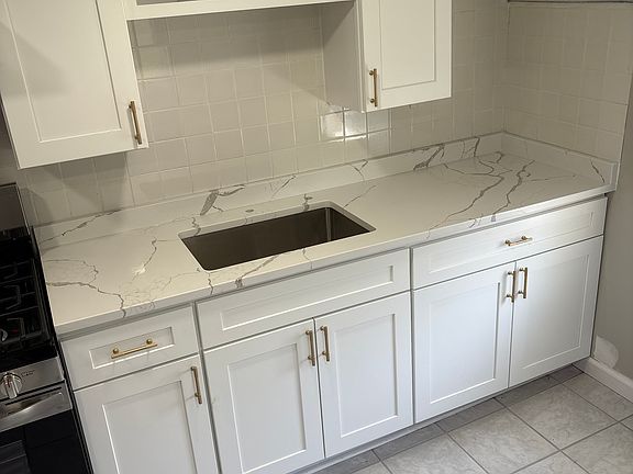 New cabinets and countertop, faucet hasn't been installed yet
