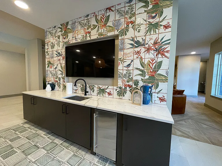 Explore this inviting kitchenette, where modern design meets artistic elegance.