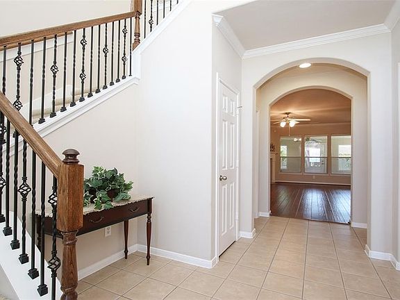 Entering this well kept maintained home, you are greeted by bright freshly painted walls and double arches leading into the living room. To the left, the stairway leads to the second level featuring wrought iron spindles and freshly stained hand rail