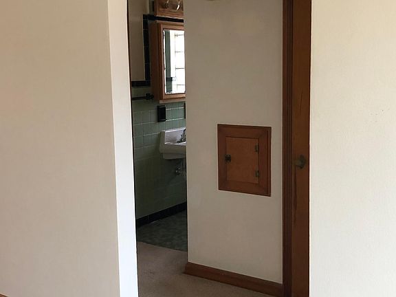 Hallway to bath and bedrooms, clothes shoot and large linen closet