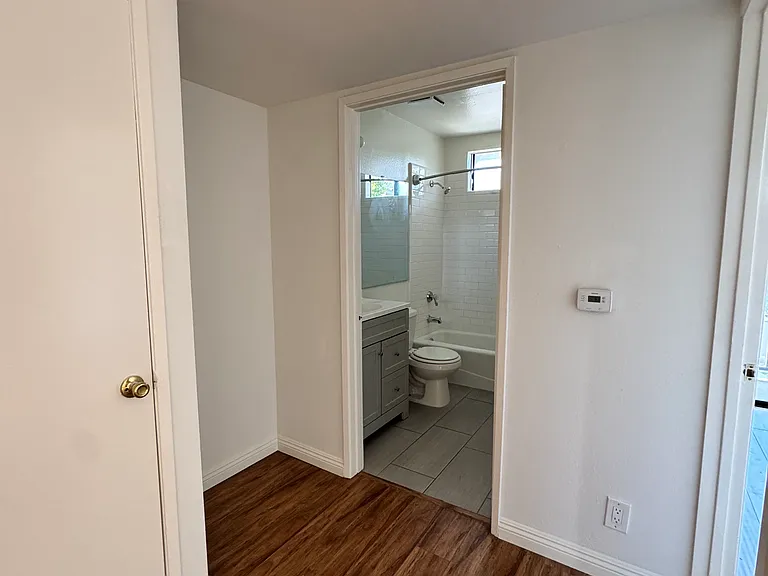 Hallway looking into bathroom from entry area
