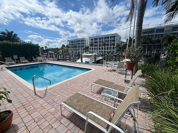 POOL & DOCK AREA LOOKING SW ACROSS CANAL